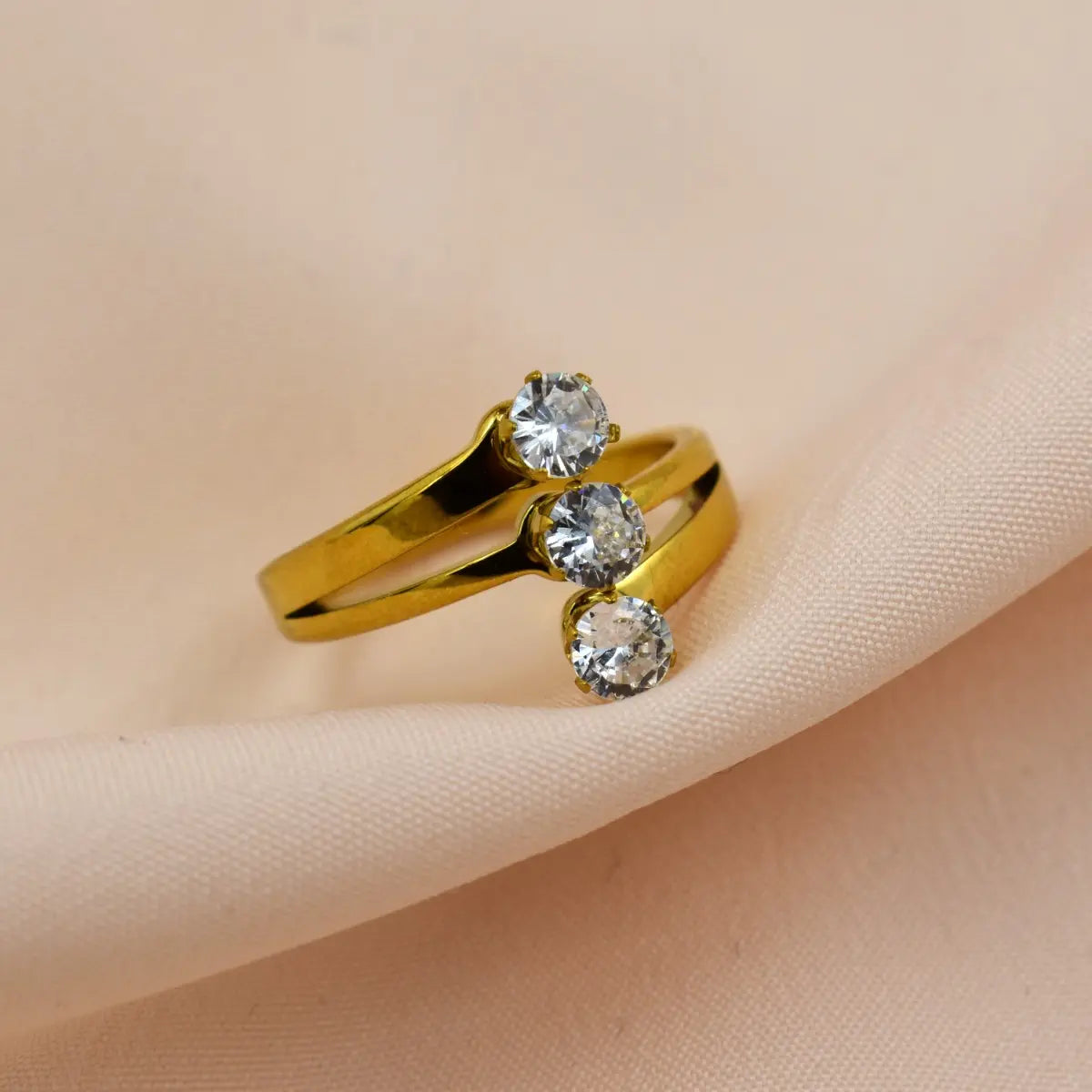 Triple Solitaire Gold Ring