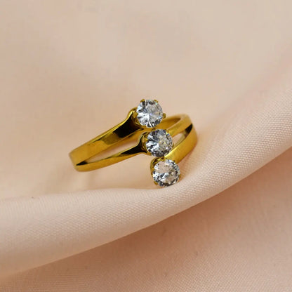 Triple Solitaire Gold Ring