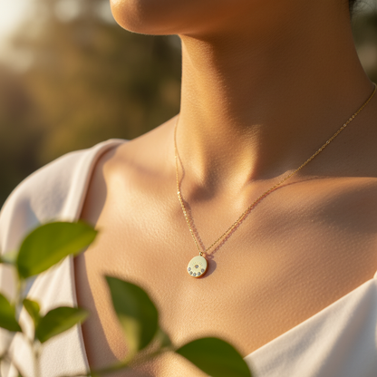 Necklace with a pendant worn by a person, with a blurred natural background